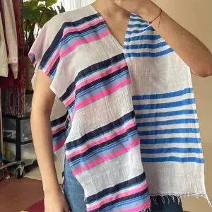 Worn as Beach Poncho or Scarf Brand New with Tags  Woven Striped Design: Blue and Pink Striping on White Fabric Handspun & Handwoven  Easy to throw on after the beach or can be worn as a scarf  85% Cotton 15% Acrylic 180CM LENGTH/ 55CM WIDTH