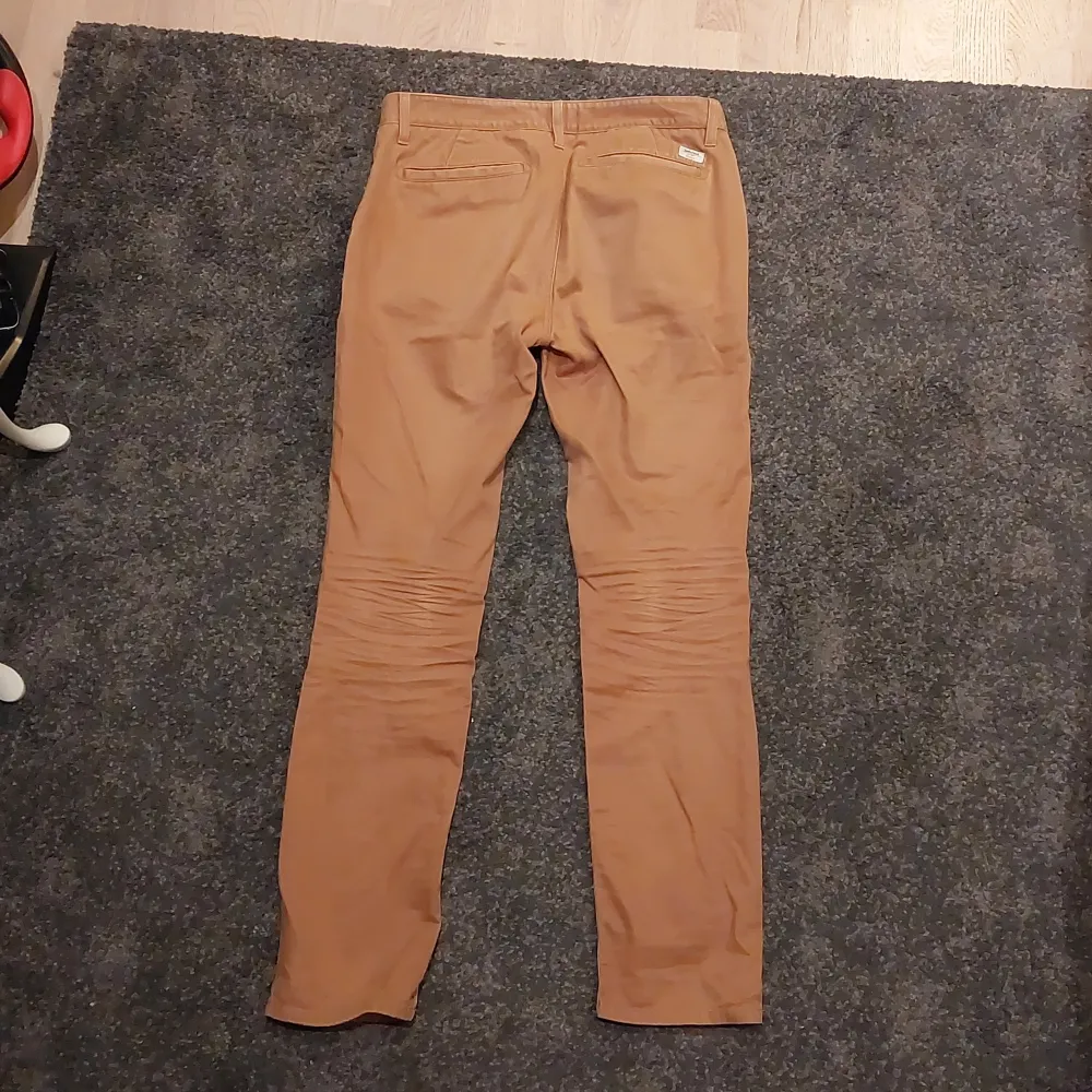 Brun orangea timberland byxor i bra skick (inga synliga skador). Slim size.. Jeans & Byxor.