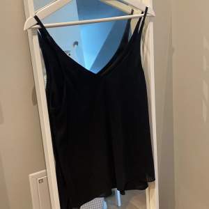Black silky cami top from Topshop UK size 10 / EU 38 deep V front and back