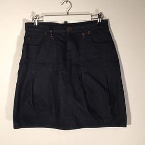 Jeans skirt with leather and button details, made in Italy