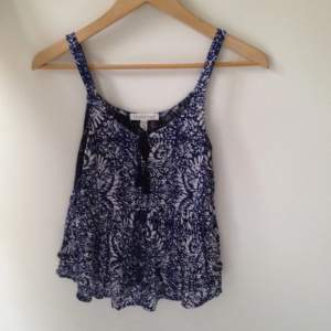 Aéropostale, blue and white tank with lace in the back and lacing in the front 
Used twice 