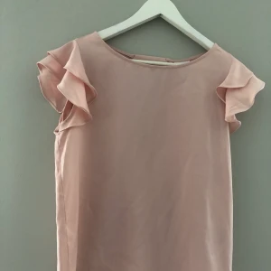 Vila topp - En rosa topp från VILA i storlek S