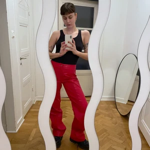 I AM G.I.A. RED LEATHER TROUSERS - LEATHER TROUSERS IN RED. SIZE LARGE. NEVER WORN WITH TAG. GOOD QUALITY. SELLING BECAUSE THEY ARE TOO BIG ON ME. 