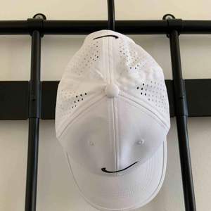 Adjustable Sports Hat with mesh in back Brand: Nike Size: N/A Colour: White  Never worn. 2 years old. 