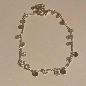  - Fin silver fotlänk i justerbar kedja, aldrig använd. 