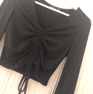 Fin topp med utsvängda armar - Nyskick använd fåtal gånger 