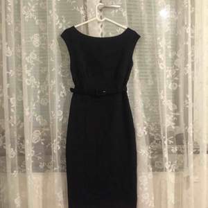 Black classic thicker stretchy cotton dress with a belt.