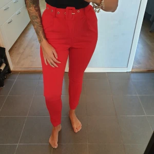 Red Tailored trousers - NEW still with labels red tailored trousers - size 40, but small in size, so i would say 36-38.