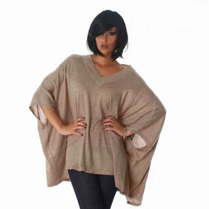  - Mysig poncho att svepa om sig i höst! Material: 55% Polyester, 20% Polyarcylic, 20% Polyamide, 5% Ull Storlek: One Size Färg: Ljusbrun