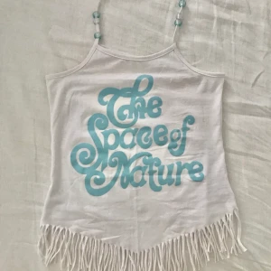 Topp - Topp med pärlor vid banden.