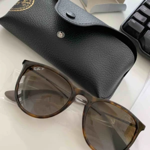  - RayBan Erica polarized. New with box (bought the wrong color).  Meet in Stockholm or buyer pays tracked shipping.