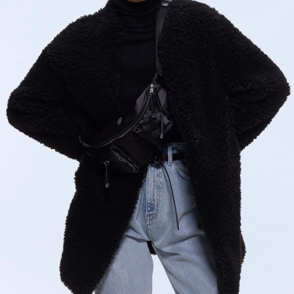 Mysig svart teddykappa