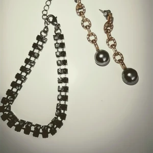 Armband och örhängen med stenar i onyx - Guldpläterade örhängen, armband med strass liknande stenar. 