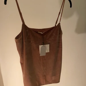 Baby Pink Stradivarius tank top  - Very nice soft (daim like fabric) top, with a double lining on the chest (covers if you want to not wear a bra). It’s new, the tag is still on! The size is M