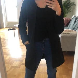 Black H&M smart coat - Easy to wear black coat from H&M, perfect condition size 34. Smart coat to be worn with a cocktail dress, also suited for adding sophistication to an informal outfit. Unfortunately, it does not suit me anymore 