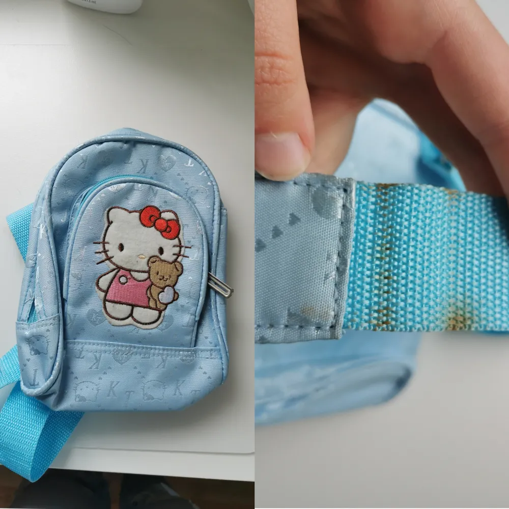 Jättefin ljusblå Hello Kitty väska. Den har en ficka på framsidan och även en till liten ficka inuti. Axelbandet går att göra både längre och kortare, dock är den lite smutsig (se bild 3) från rost som kommer från ett av spännena. 70kr + 44kr frakt. Väskor.