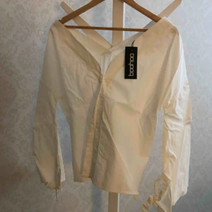  - Flute sleeve shirt