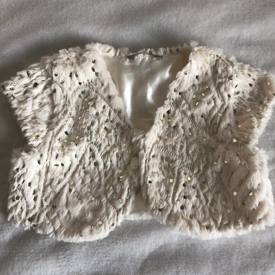 Vit väst med paljetter från lindex