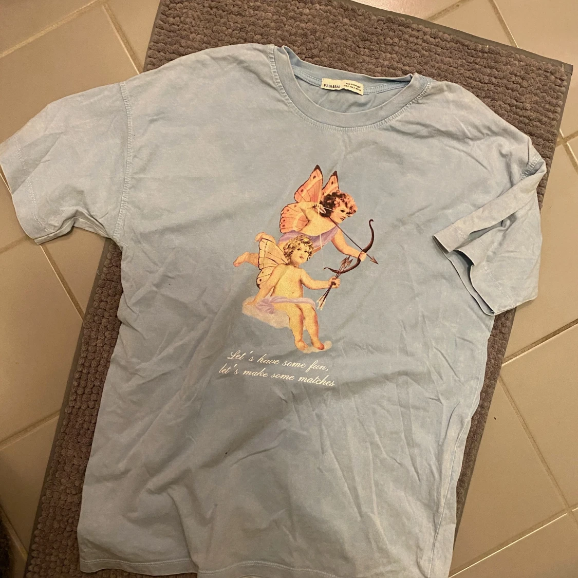 Ljusblå t-shirt - 90