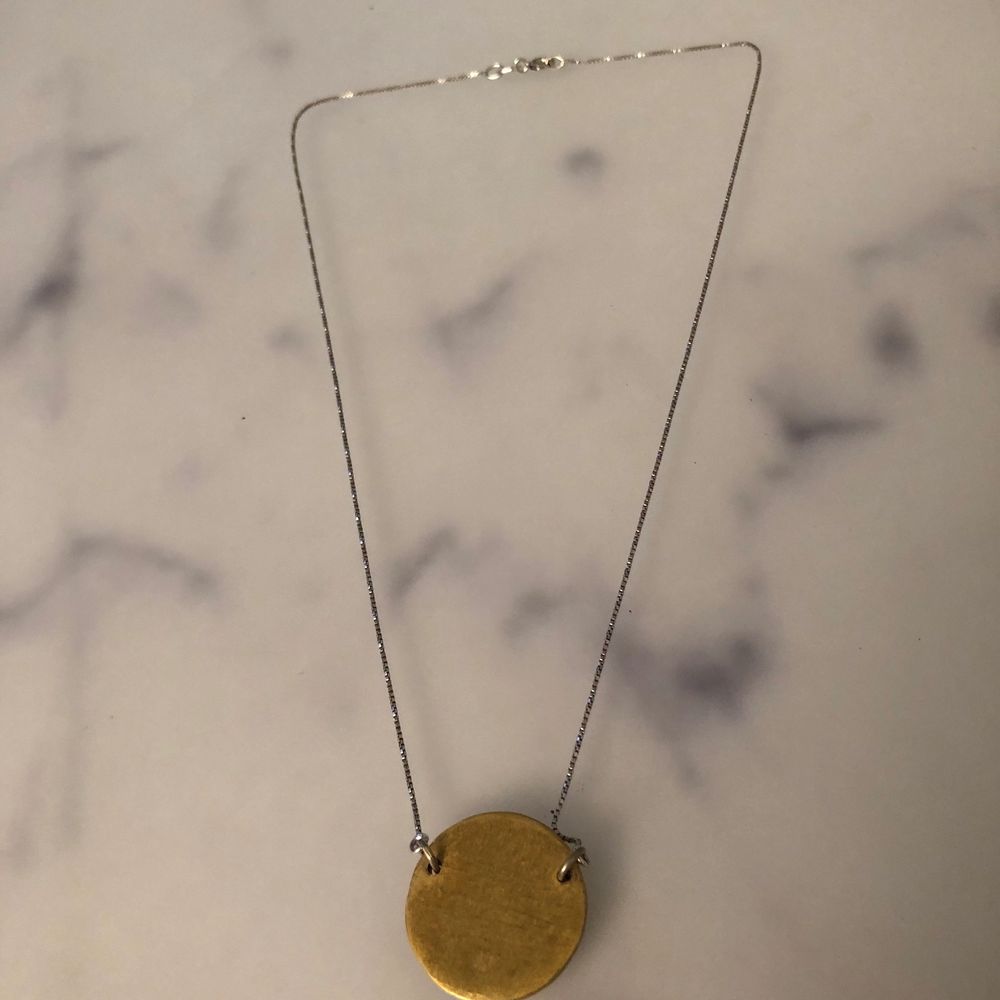 This necklace is completely handmade and constructed by designer studio in Zagreb in Croatia. GOLDEN LUCKY COIN necklace features brass pendant, suspended from a silver chain. Pick up available in Kungsholmen. Please check out my other items! :). Accessoarer.