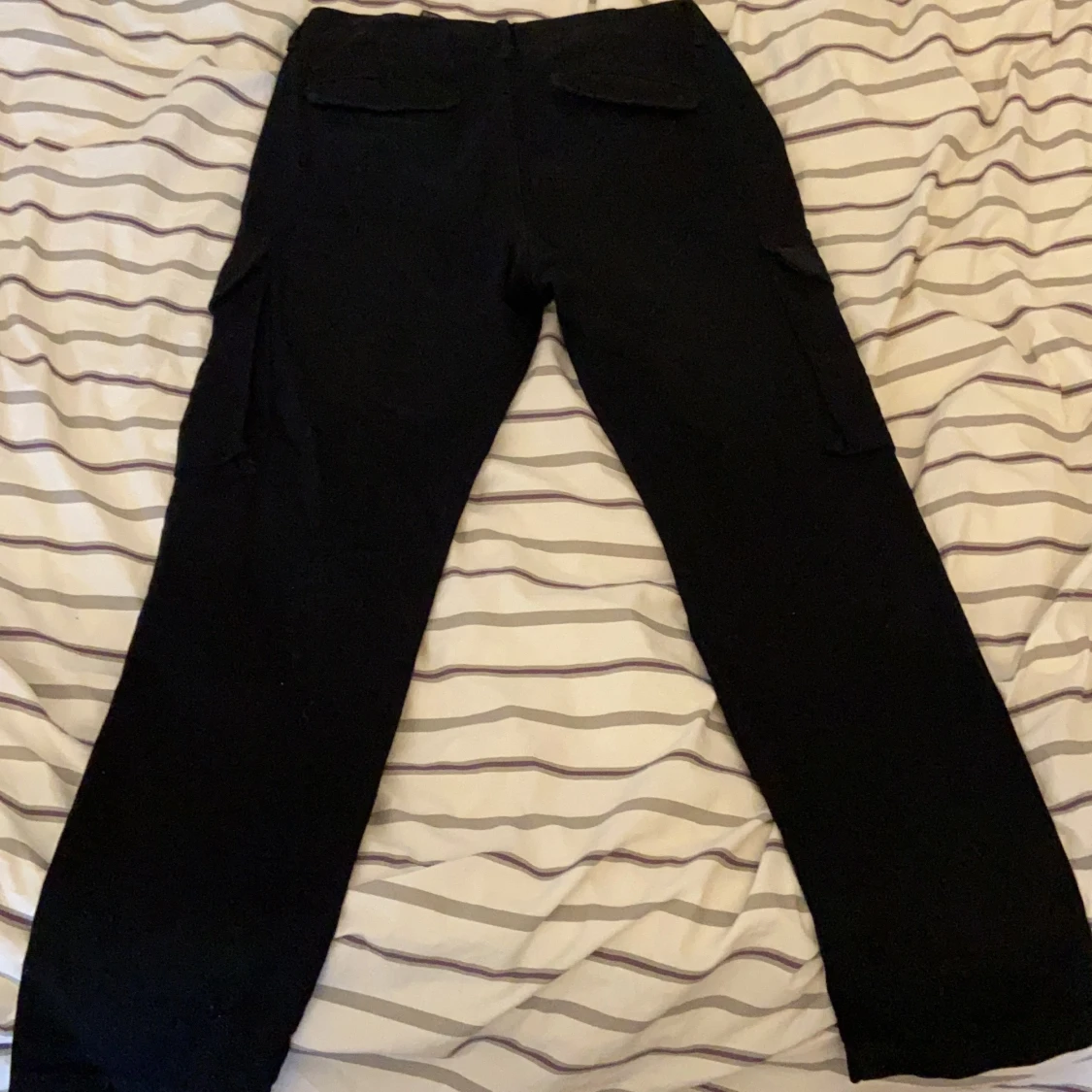 Ett par svarta byxor i storlek EUR 40/USA 31 - 90