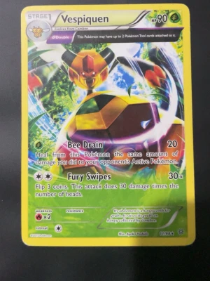 Pokémonkort Vespiquen 11/98 - Säljer ett Pokémonkort med Vespiquen från serien Ancient Origins, nummer 11/98. Kortet har gul ram, färgglad illustration och visar attackerna Bee Drain och Fury Swipes. Perfekt för samlare eller Pokémonfans!
