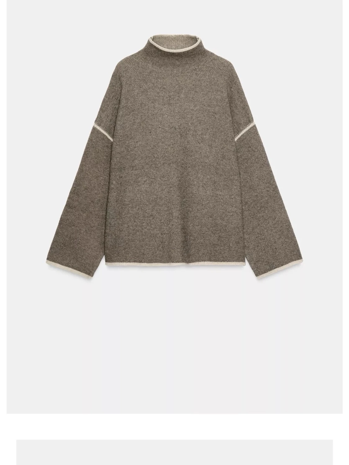 Brun stickad tröja med kontrastdetaljer