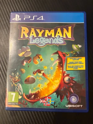 Rayman Legends till PS4 - Rayman Legends till PlayStation 4 är ett färgstarkt och actionfyllt plattformsspel med tecknad grafik. Spelet kommer i ett blått plastfodral och innehåller både omslag och skiva. Perfekt för dig som gillar äventyr och utmanande banor.