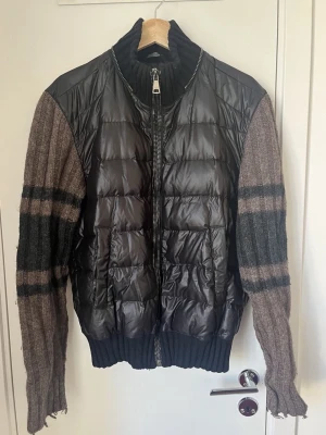 Dolce & Gabbana jacket FW 2008 size 48 M/L - Black Dolce & Gabbana jacket from the FW 2008 collection. A hybrid of knitted sleeves in brown and black and zipper details at the front and around the neck.  Feel free to message me with any questions🫡