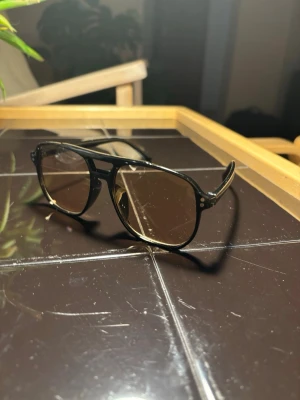 Black and orange sunglasses from Spain - Sunglasses in a nice black and orange colorway that i bought from spain from a street vendor, never used