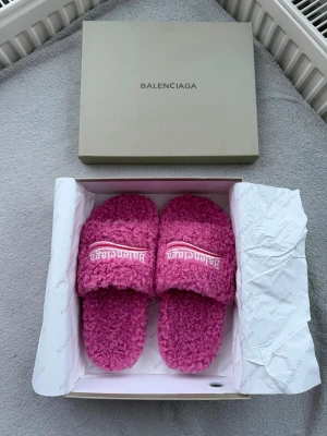 Balenciaga Pink Teddy Fur Slides Size 38 – Like New - Authentic Balenciaga teddy/shearling slides in pink.  Condition: 10/10 – worn once, no flaws. Size: EU 38 – fits true to size.  Super soft textured upper with embroidered logo. Comes with original box and packaging as shown.  Perfect statement summer or lounge piece. Message for any questions 🌸