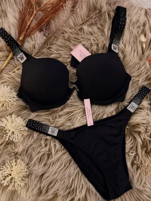 Victoria’s Secret Black Set 75B + M ✨ NEW with Tags - Brand new Victoria’s Secret black set 🖤 Bra size 75B +pushup Panties size M Original tags attached.                                                            ✨ 100% original Victoria’s Secret ✨ NEW with tags ✨ Rhinestone logo straps ✨ Classic, versatile design