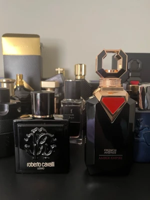 French avenue Amber empire & Roberto Cavalli Uomo EDT - Both perfumes come with original boxes. Amber empire has about 80ml/100ml left( hard to estimate but I bought it two weeks ago), and RC UOMO EDT has also 80ml/100 left .