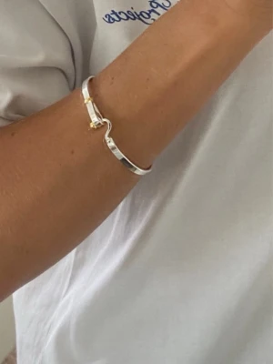 Argent Doré - Clean, dual-tone bracelet in silver and gold.