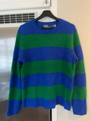 Polo Ralph Lauren knitted sweater -  Super soft Wool/Alpaca sweater. Rugby stripes and suede elbow patches give it a distinctly Polo look. 