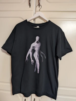 Gothic Y2K Shirt - Size M - Black shirt with printed Gothic motif. Never used.  Size M, excellent condition.  Message me if you have any questions 🤍   Check my other listings 🌿