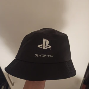 Yung Lean type H&M Playstation bucket hat  - Looks like something Yung lean would've worn back in the ginseng strip era. Has reflective material. 