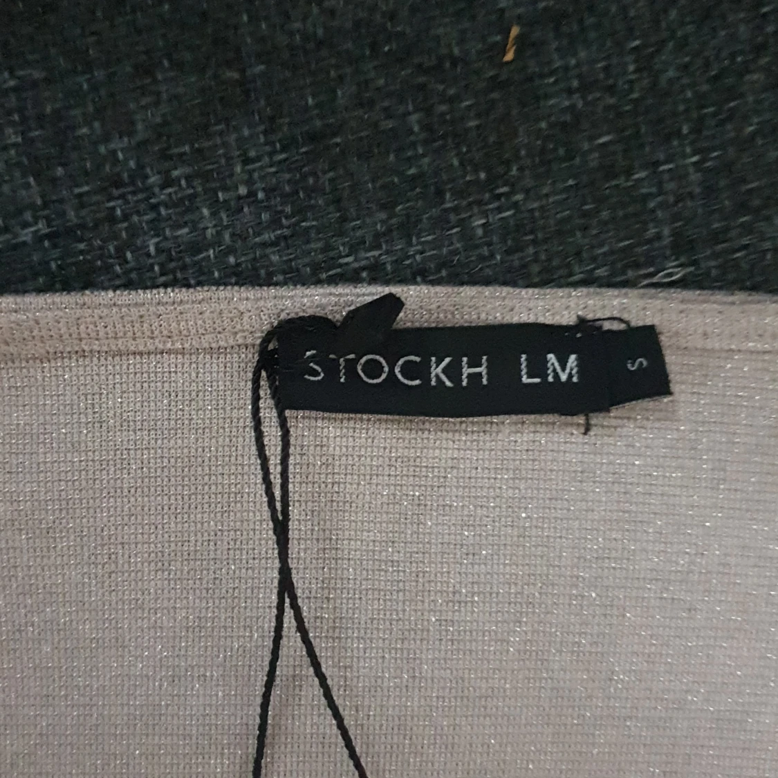 Glittrig omlottopp från STOCKH LM - 1