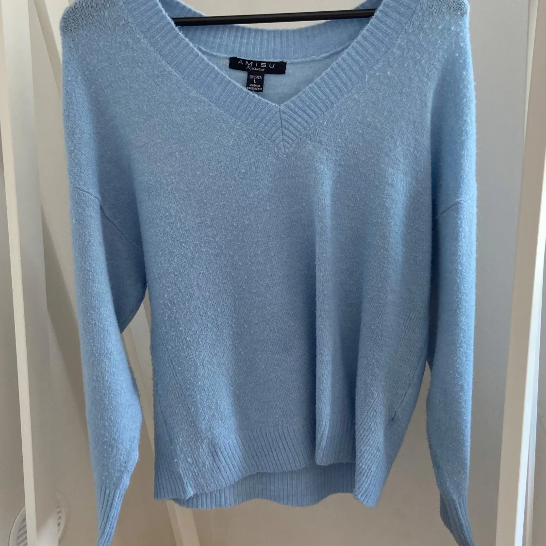 Ljusblå stickad tröja från Amisu