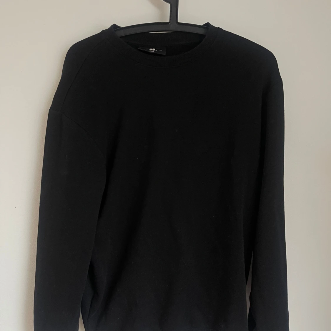 Svart sweatshirt från H&M Relaxed Fit