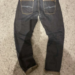 Nudie Grim Tim - Feta Nudie jeans | Storlek 30/32 |