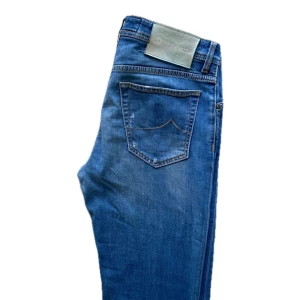 Jacob Cohën Jeans. - Jacob Cohën, Ljusblå. Strl 31. Okej skick. Fin tvätt.