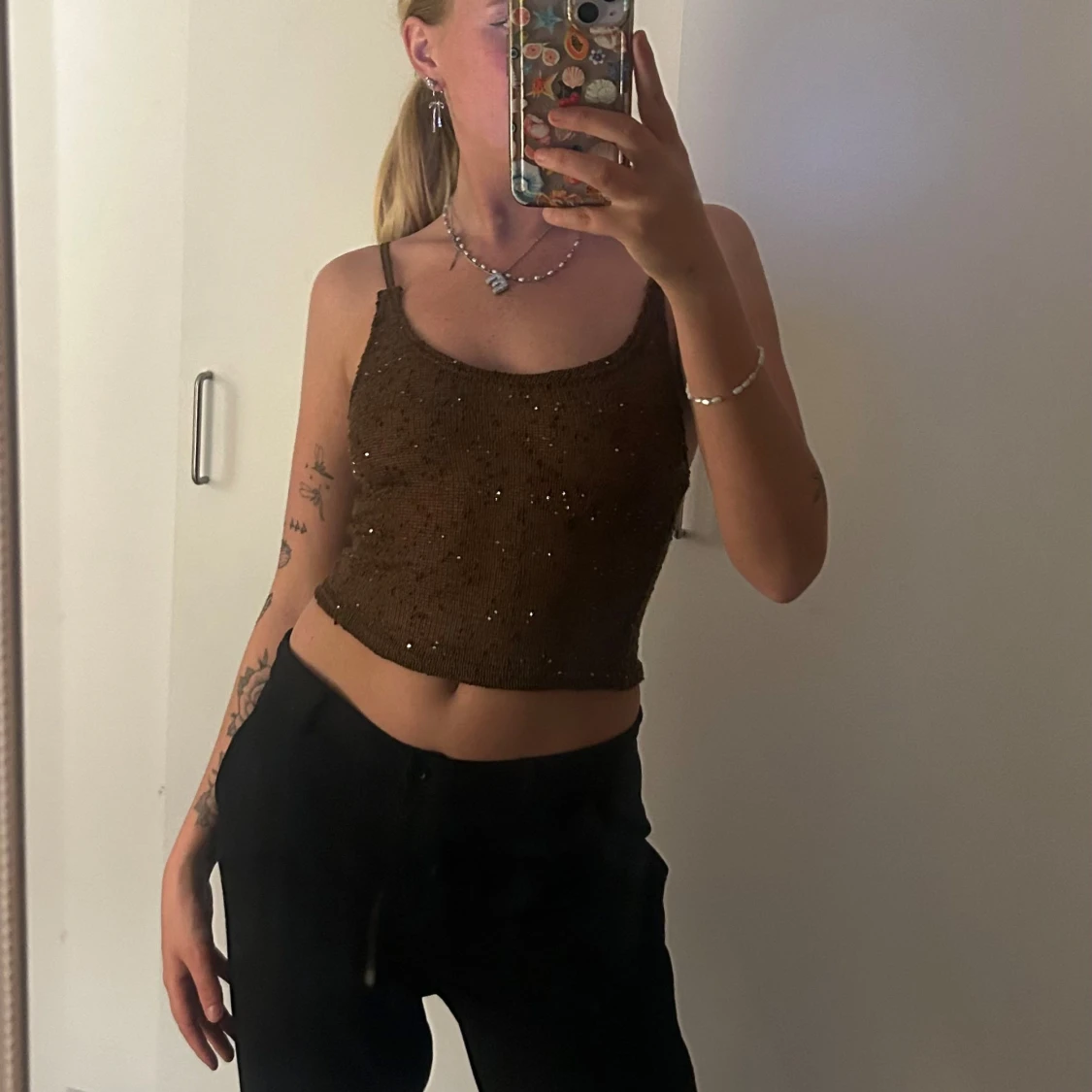 Brun glittrig stickad linnetopp