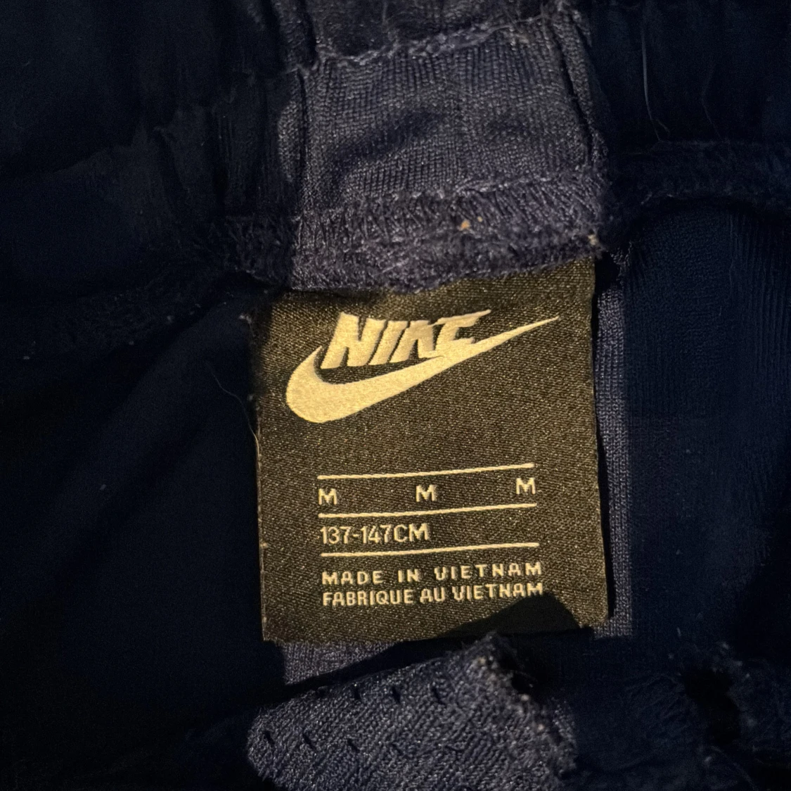 Nike Air blå mjukisbyxor med vita och svarta  ränder - 1