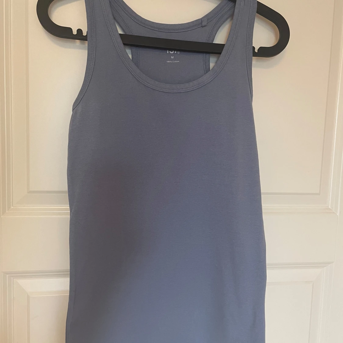 Ljusblå linnetopp i bomull