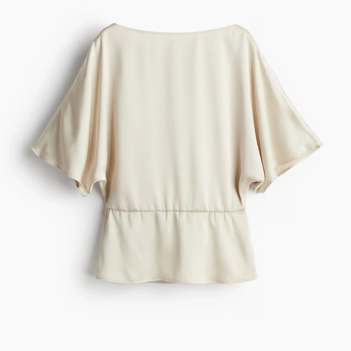 Ljusbeige blus med vida ärmar