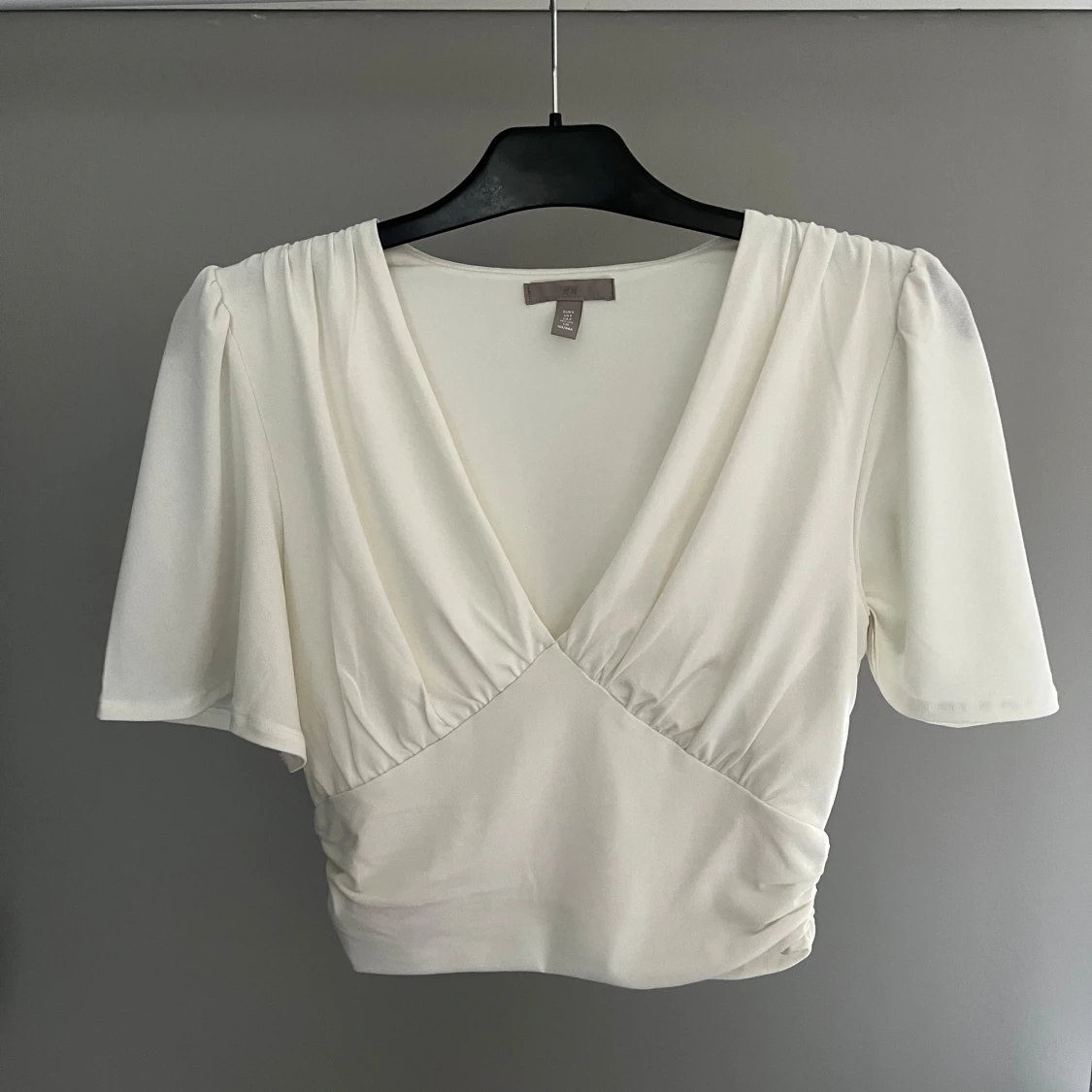 Vit v-ringad topp från H&M