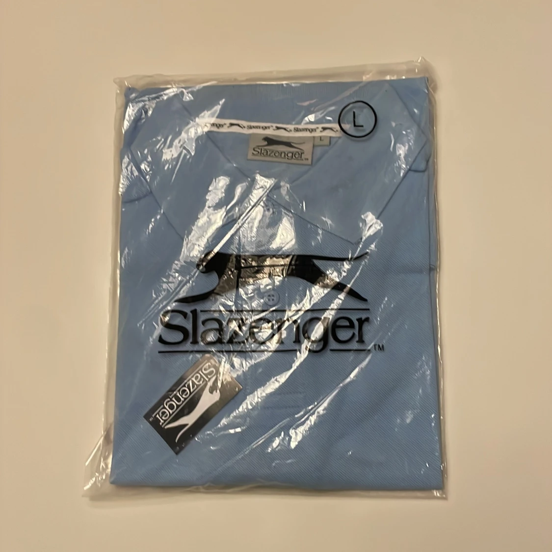 Ljusblå pikétröja från Slazenger