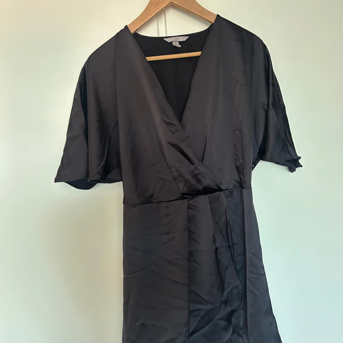 Svart omlottklänning från H&M