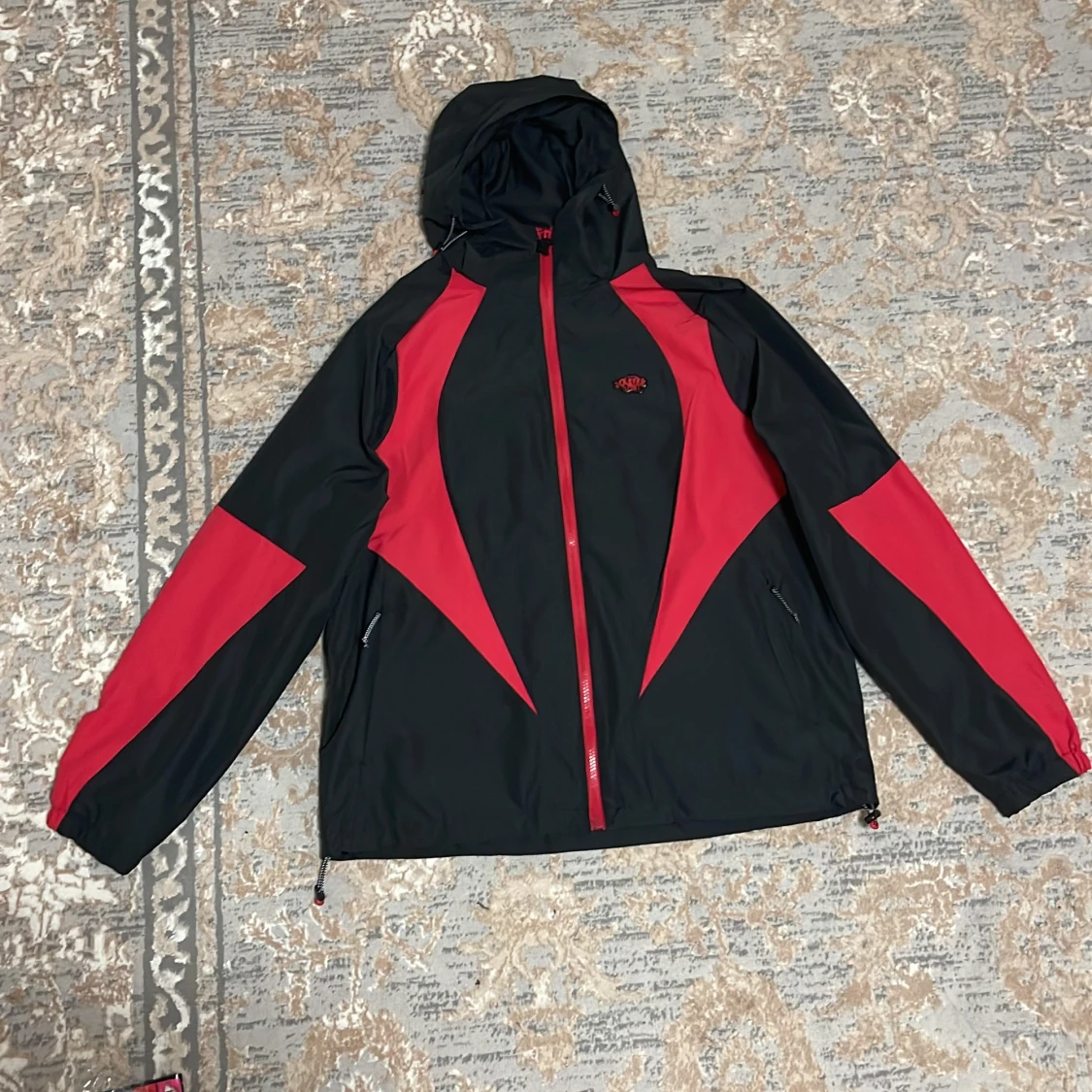 ”Syna world windbreaker 